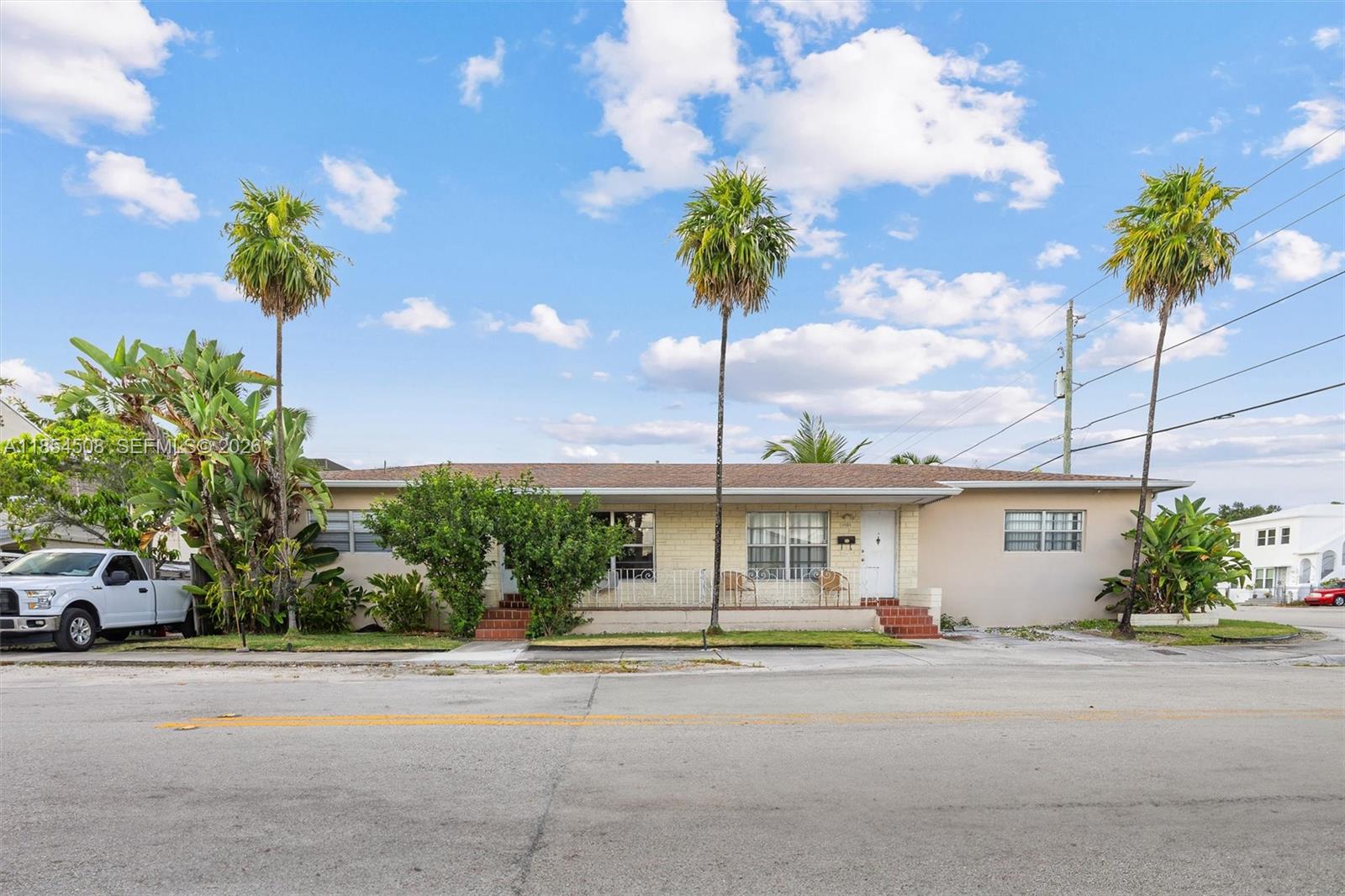 1701 Southwest 21st Street Miami, FL 33145 - Photo 2 of 29 a front view of a house with a garden