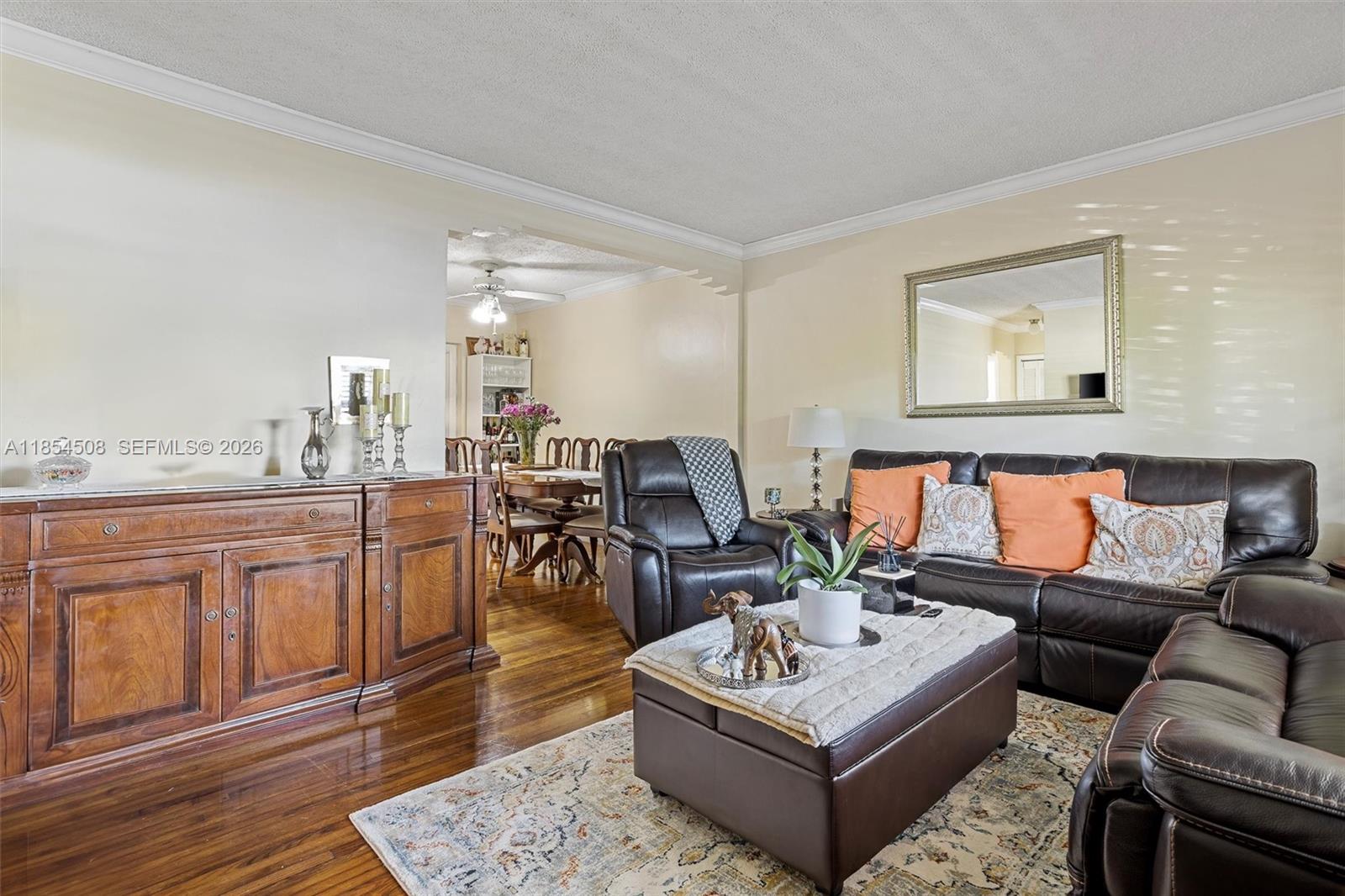 1701 Southwest 21st Street Miami, FL 33145 - Photo 3 of 28 a living room with furniture a rug and kitchen view