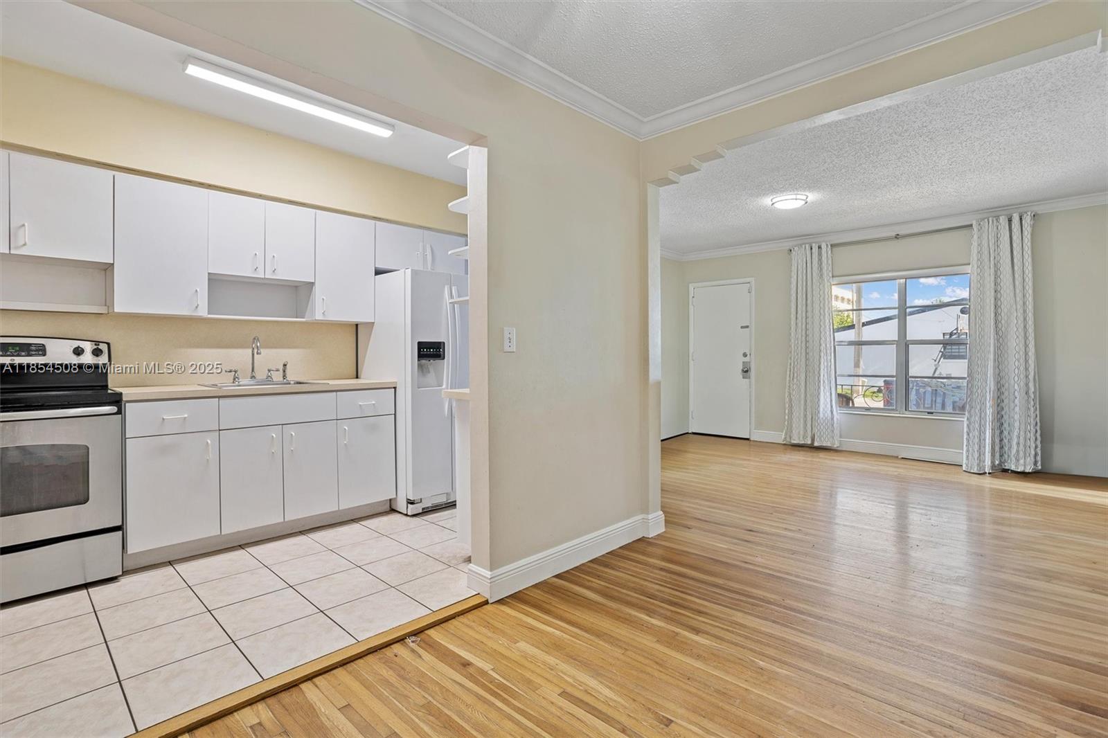 1701 Southwest 21st Street Miami, FL 33145 - Photo 5 of 29 a view of a kitchen with dishwasher and wooden floor