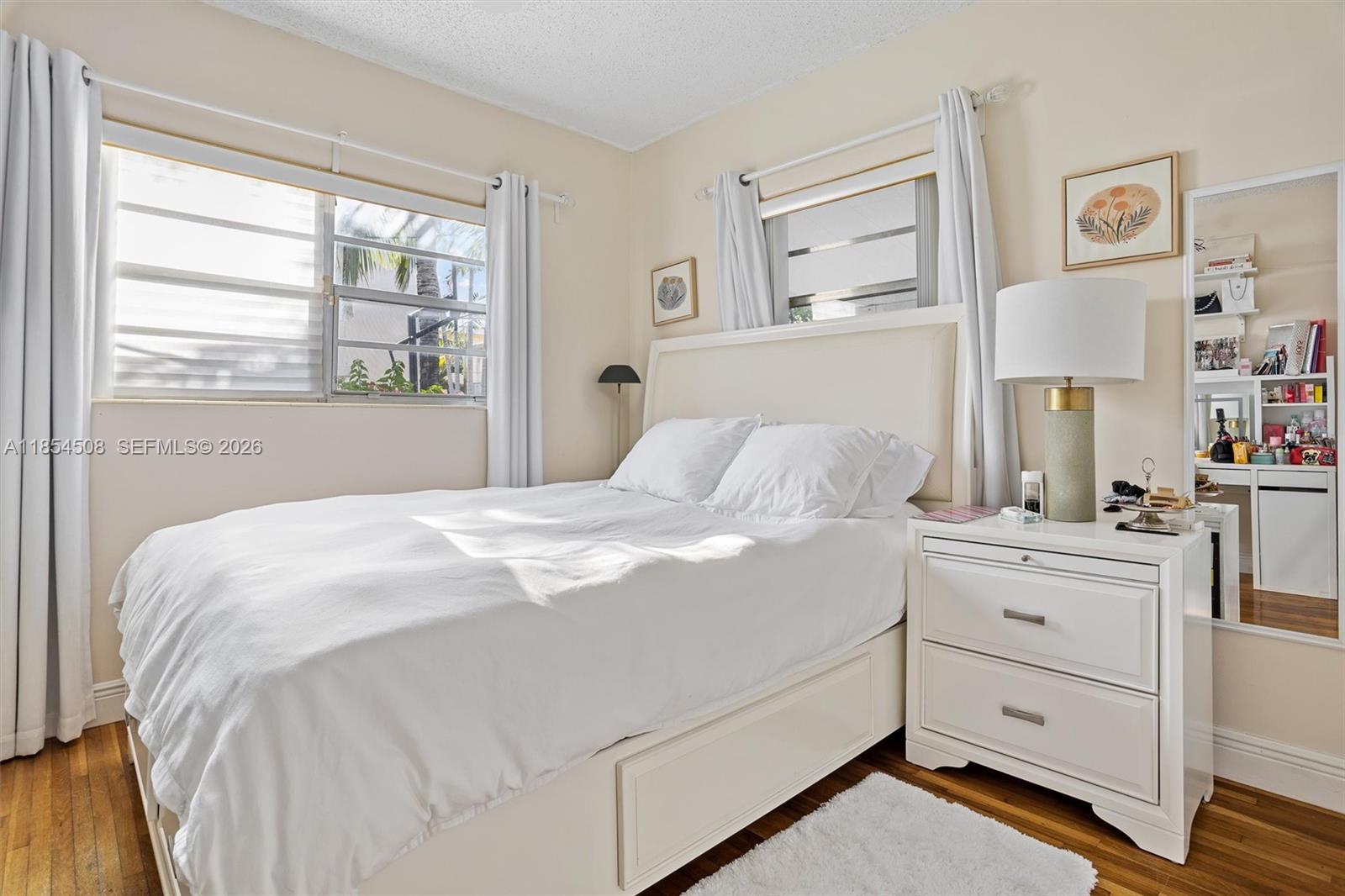 1701 Southwest 21st Street Miami, FL 33145 - Photo 10 of 28 a bedroom with a bed and a window