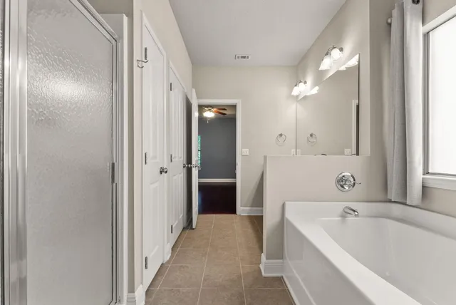 a view of a backyard with pathway