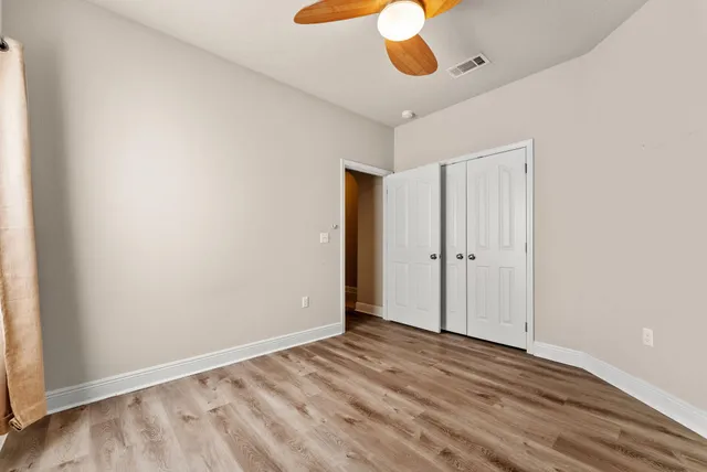 a view of a patio with dining table and chairs with a barbeque grill and couches