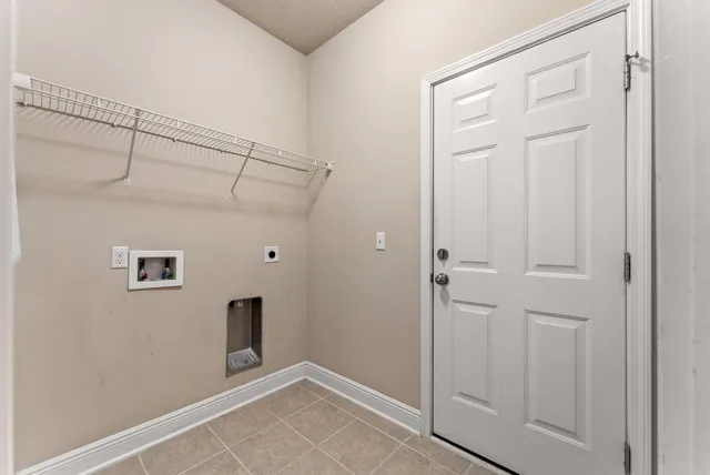 a view of a swimming pool with a yard and seating area