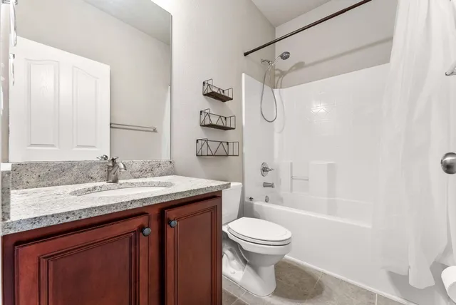 a backyard of a house with lots of green space and trees