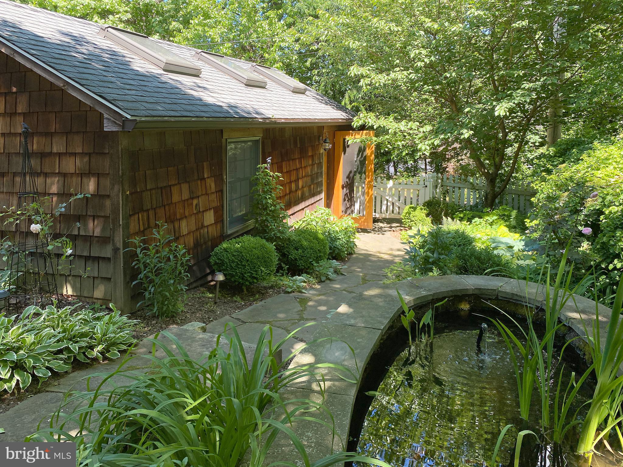 4509 Wilmslow Road Baltimore, MD 21210 - Photo 14 of 73 Stone walkway and fish pond with fountain.