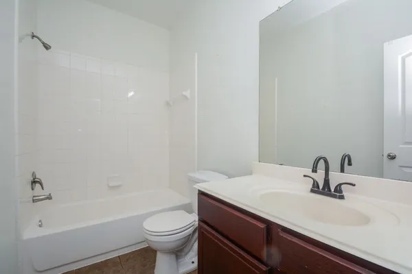 a bathroom with a sink a toilet and a bathtub