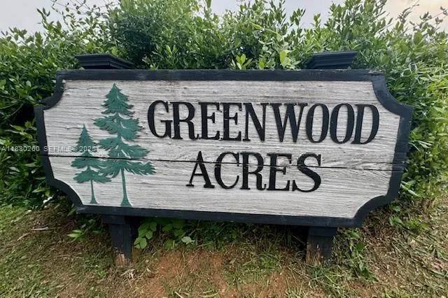 a view of a wooden bench under an umbrella