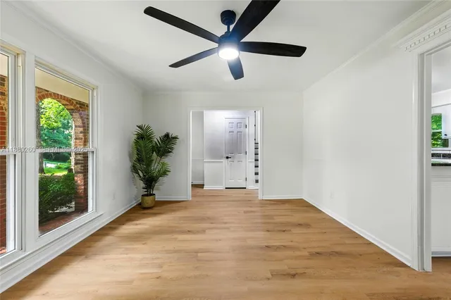 a view of an empty room with a balcony
