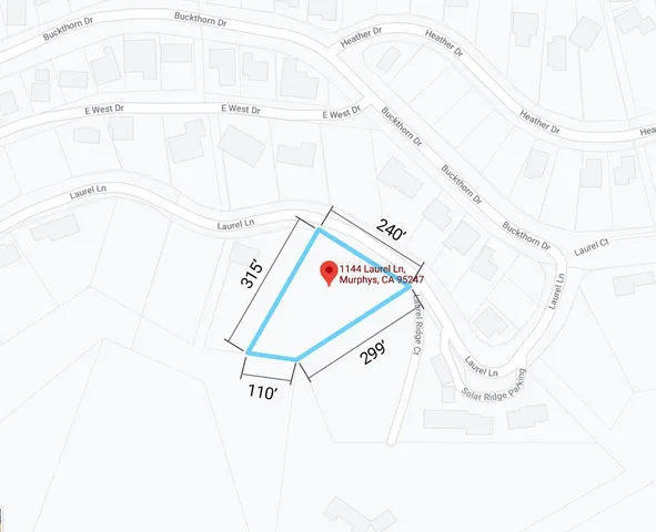 a utility room with a shower and a mirror