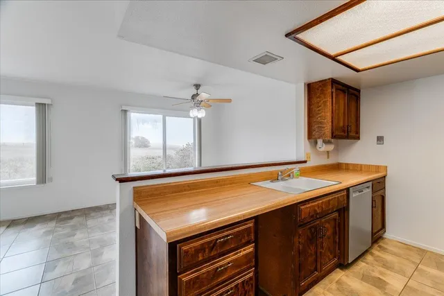a kitchen with a stove and a refrigerator