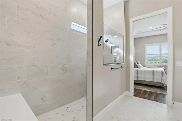 a bathroom with a tub and shower
