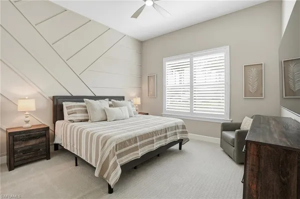 a spacious bedroom with a bed and a couch