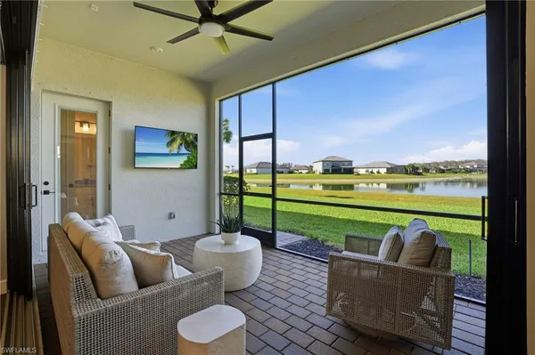 a living room with furniture and a garden