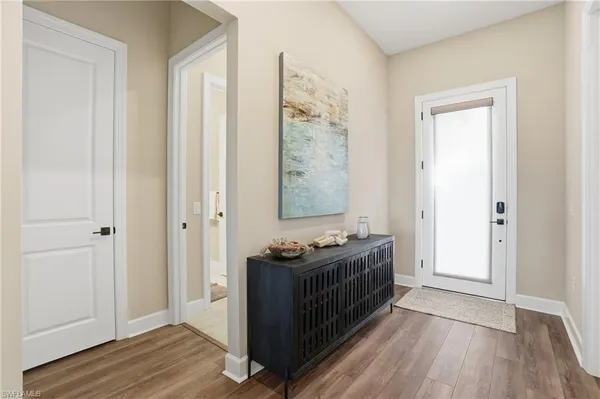 a view of room with furniture and wooden floor