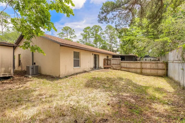 a view of a yard with a tree