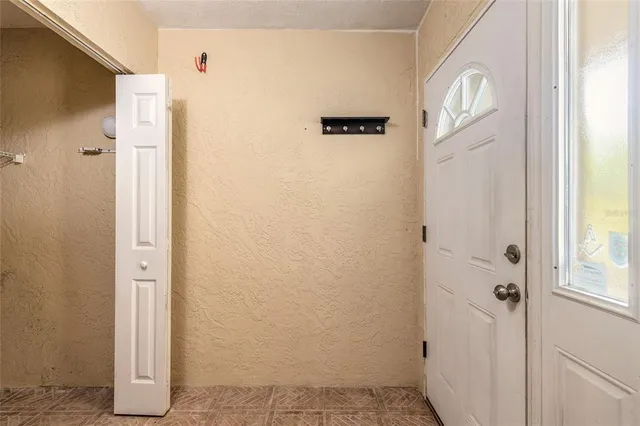 a view of bathroom with a sink and mirror