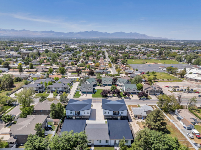 7045 South 300 East Midvale, UT 84047 - Photo 49 of 49 Aerial perspective showcasing a developed suburban landscape with distant mountains