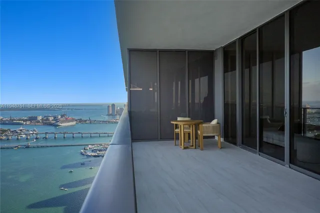 a bedroom with a bed and a night stand