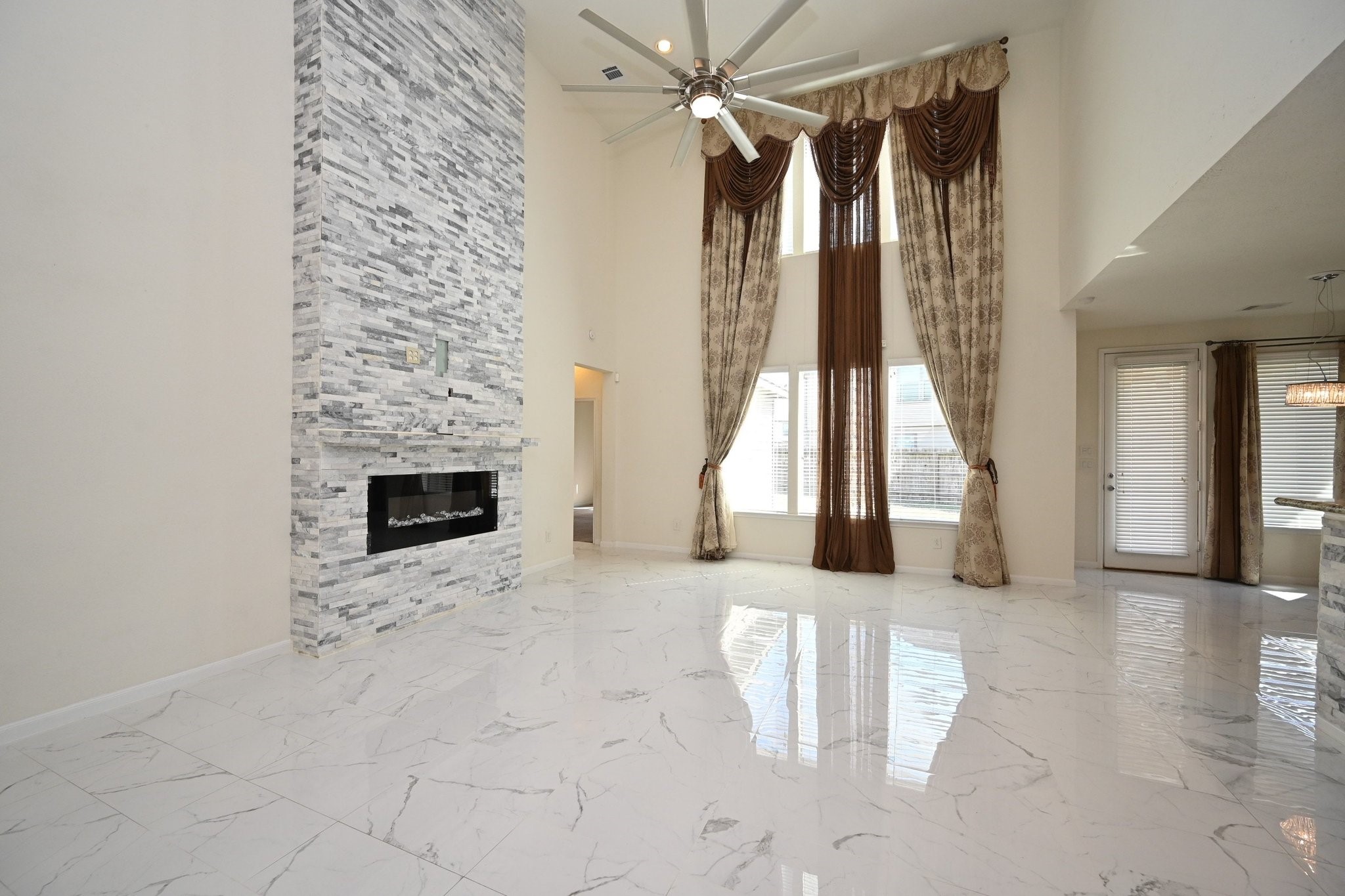 21119 Keystone Pine Court Katy, TX 77449 - Photo 13 of 43 a view of a livingroom with wooden floor and a fireplace