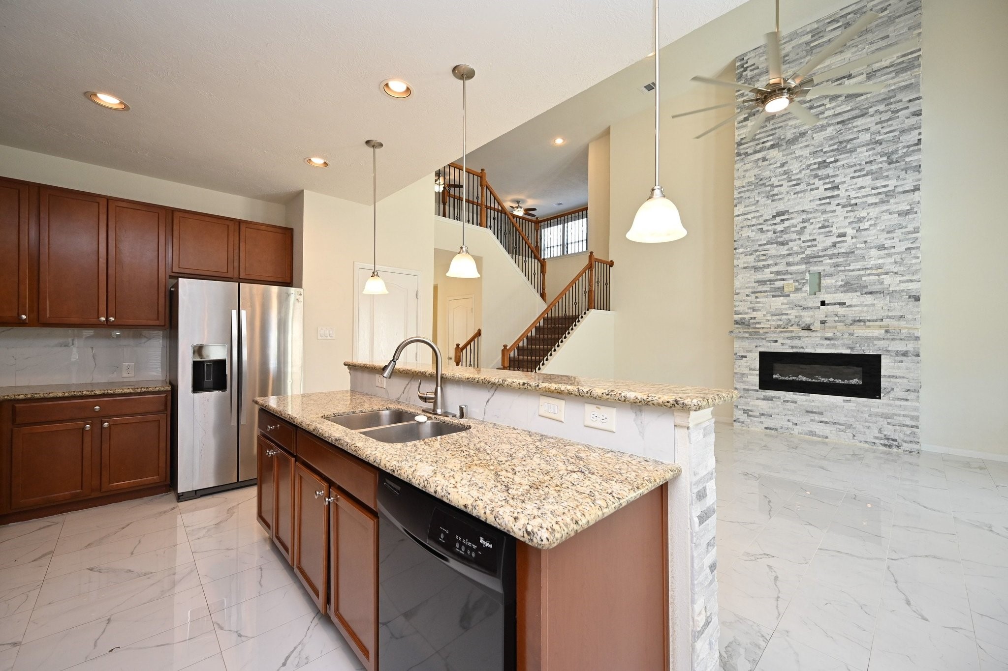 21119 Keystone Pine Court Katy, TX 77449 - Photo 18 of 43 a kitchen with a sink a stove a refrigerator and cabinets
