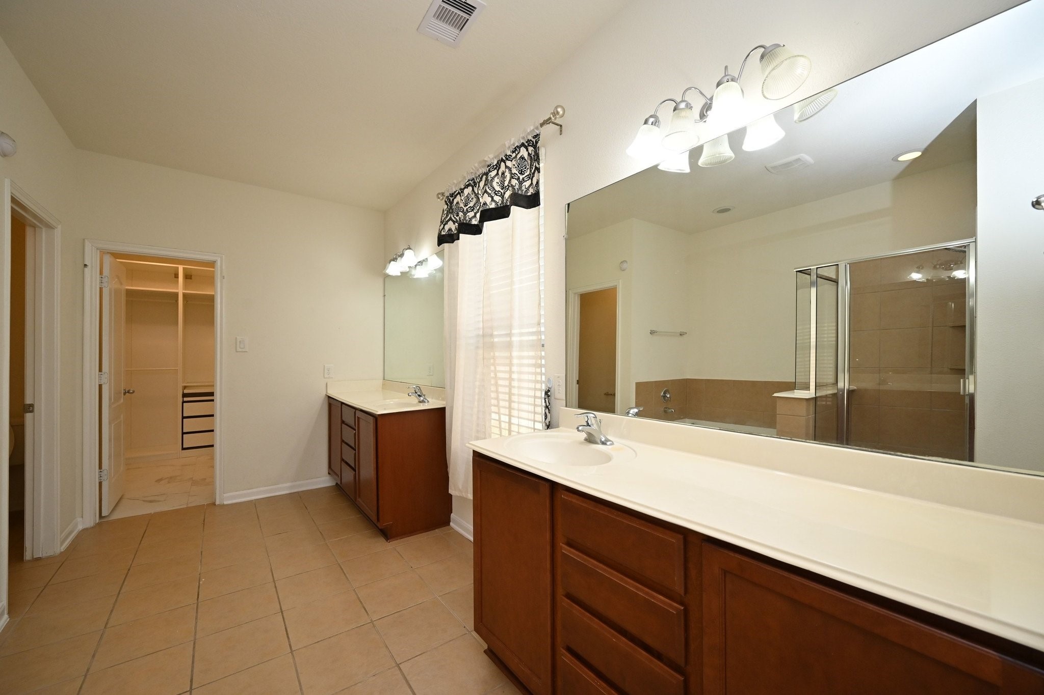 21119 Keystone Pine Court Katy, TX 77449 - Photo 27 of 43 a bathroom with a tub sink and mirror