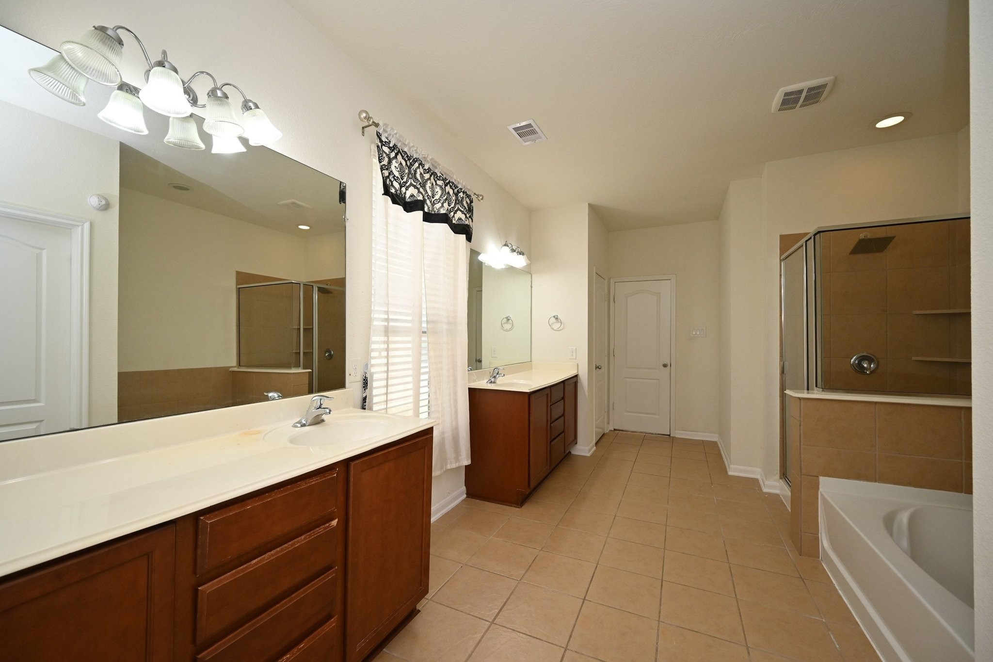 21119 Keystone Pine Court Katy, TX 77449 - Photo 30 of 43 a spacious bathroom with a tub sink and mirror