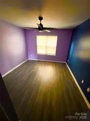 a view of an empty room and a window