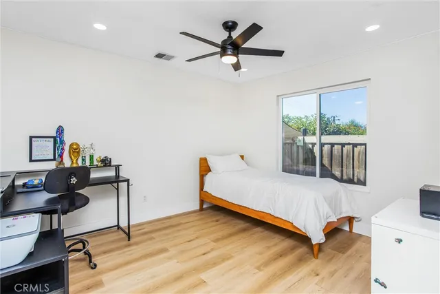 a bedroom with a workspace