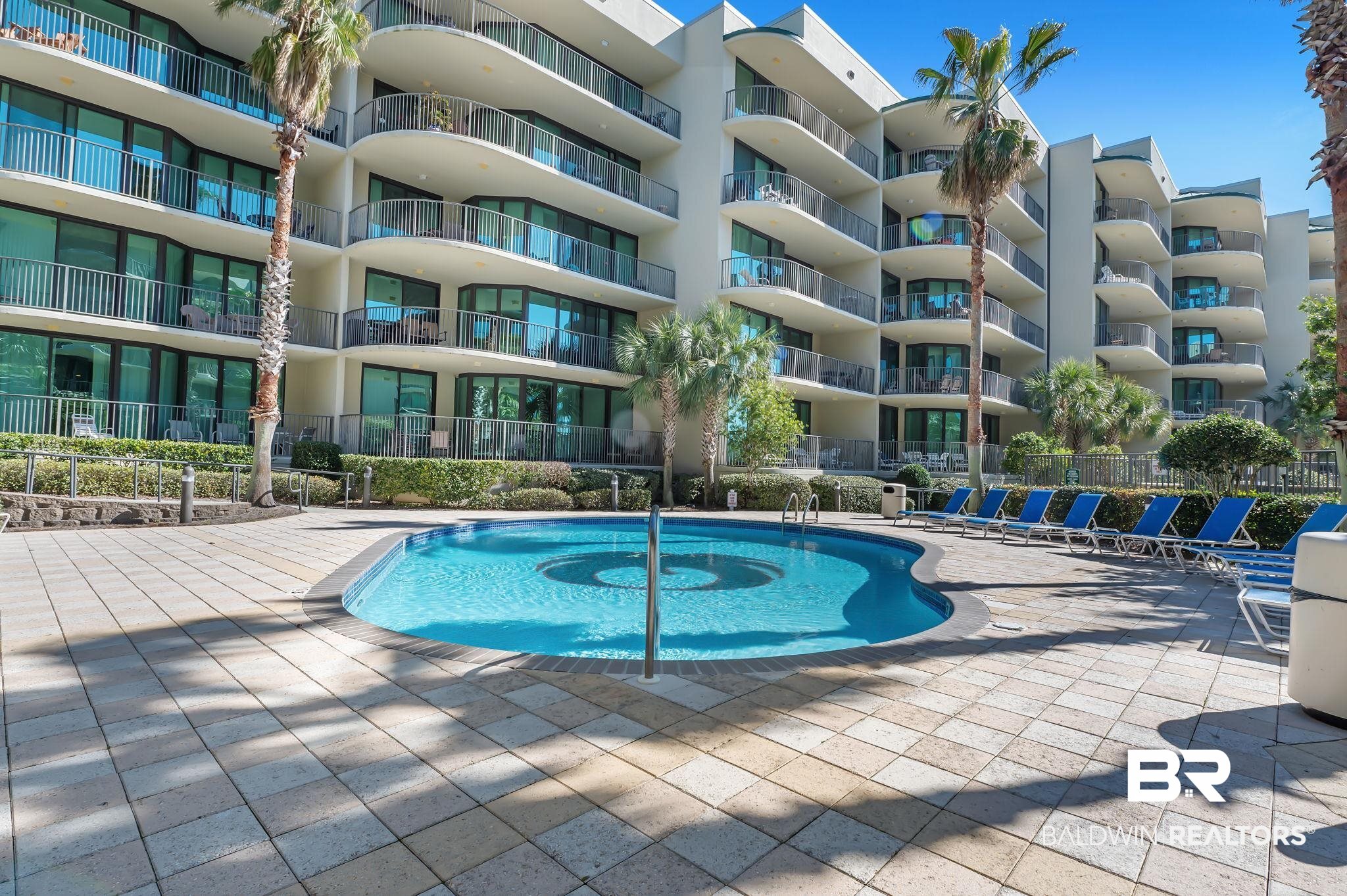 27580 Canal Road, Unit 1112 Orange Beach, AL 36561 - Photo 36 of 50 Community pool with a patio area