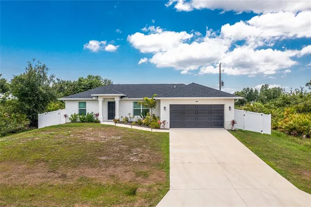 a front view of a house with yard