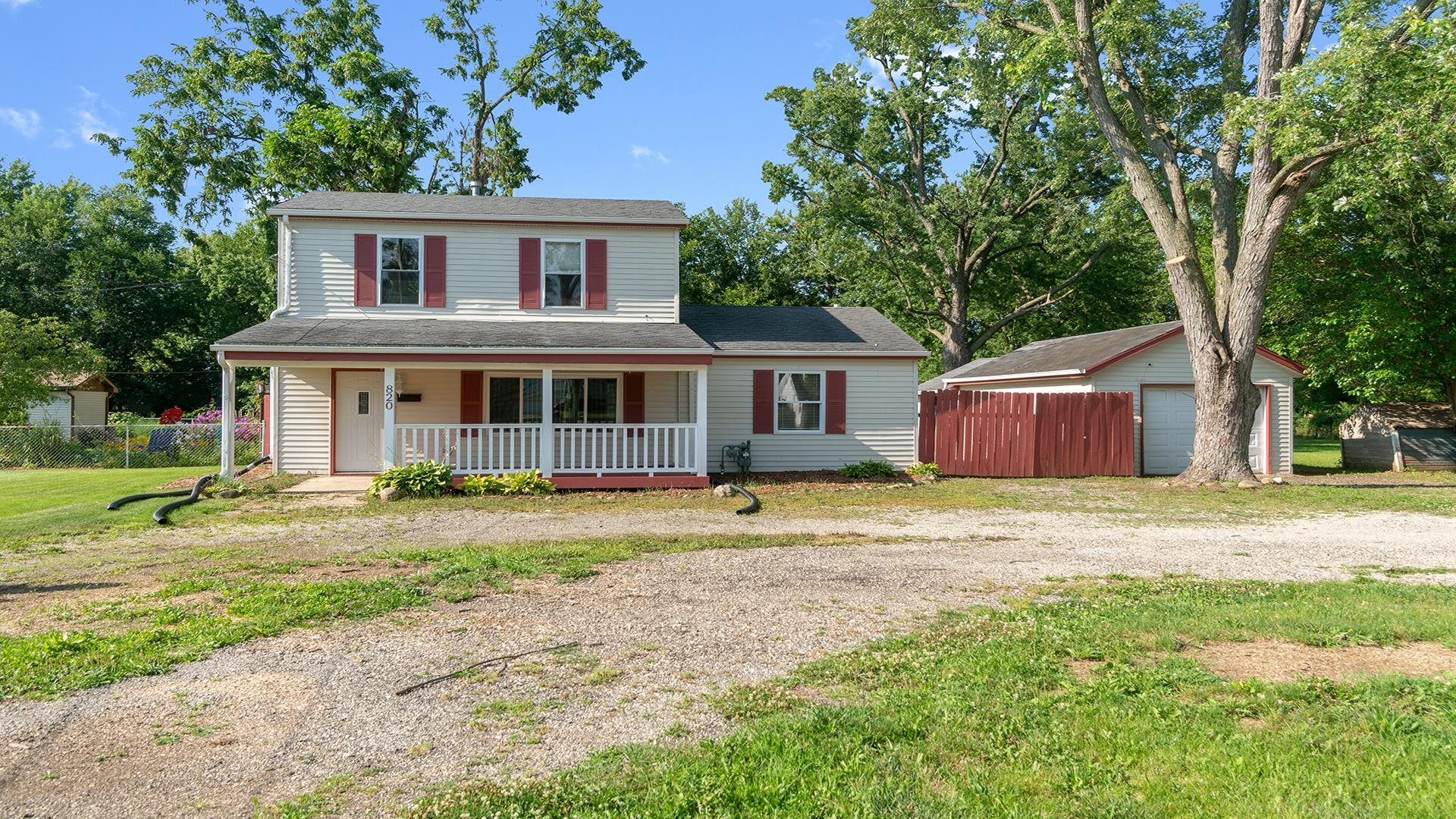 820 East Riverside Boulevard Loves Park, IL 61111 - Photo 1 of 32 a front view of a house with a yard