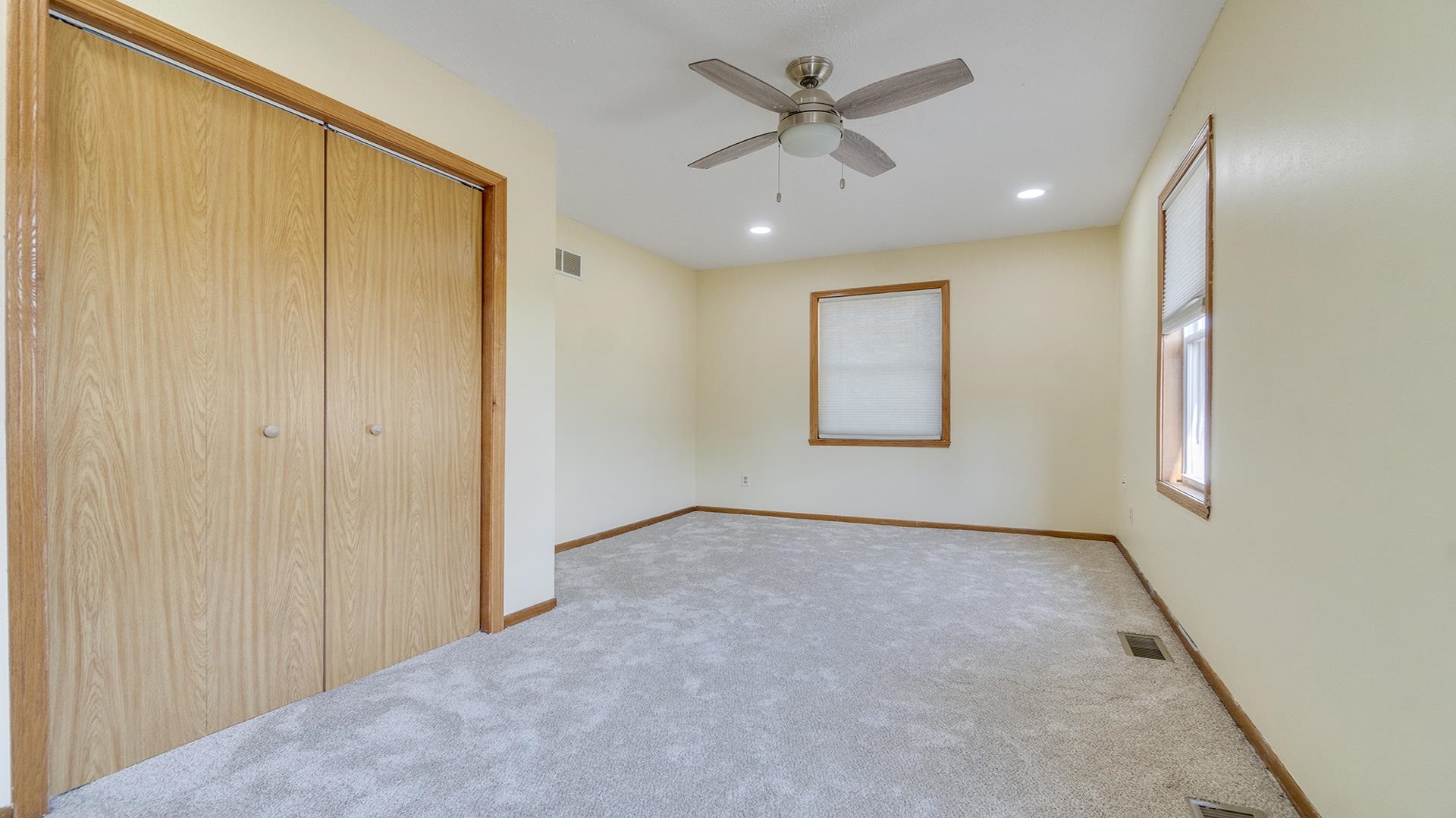 820 East Riverside Boulevard Loves Park, IL 61111 - Photo 15 of 32 an empty room with windows and closet