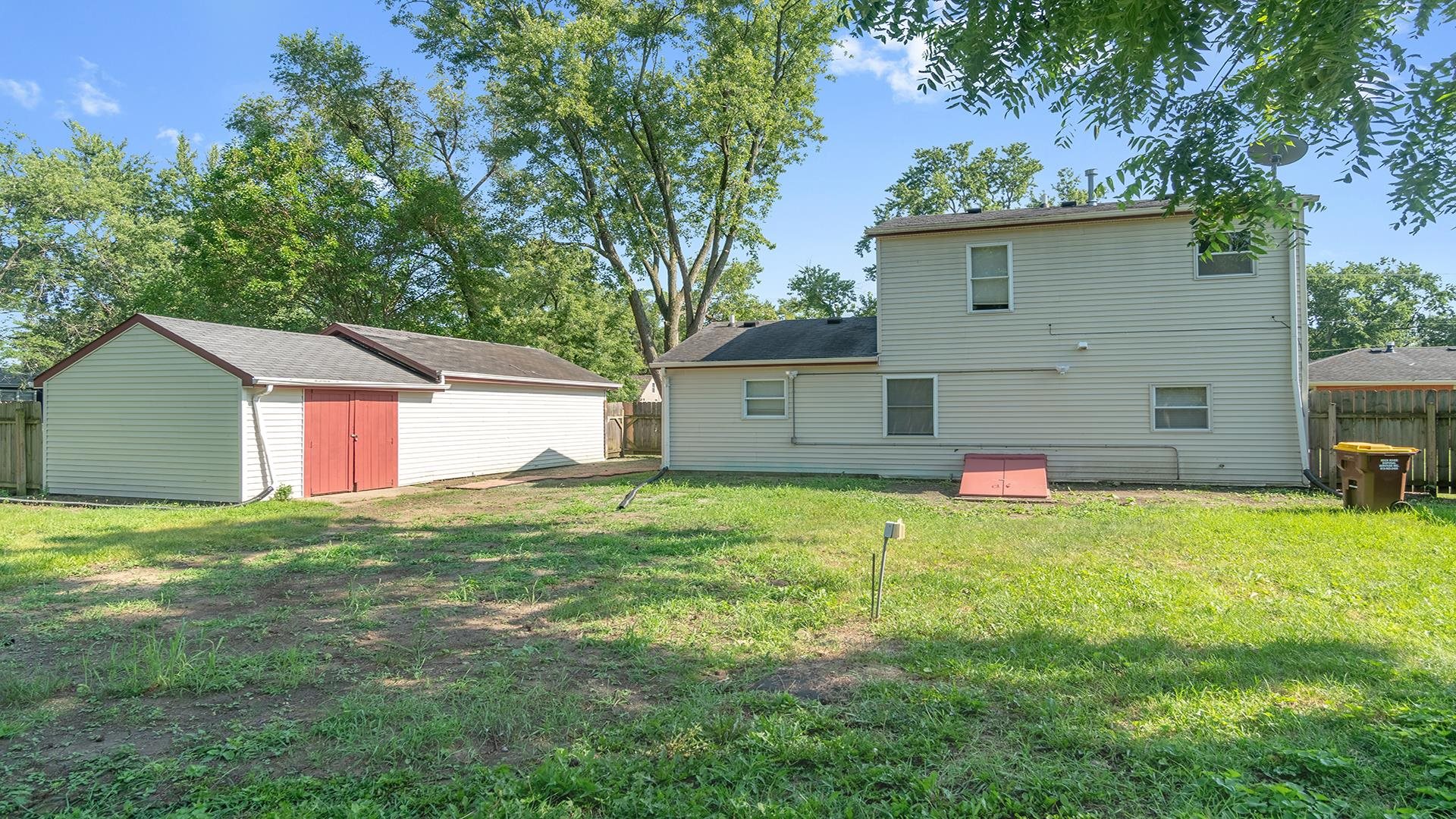 820 East Riverside Boulevard Loves Park, IL 61111 - Photo 25 of 32 a house view with a garden space
