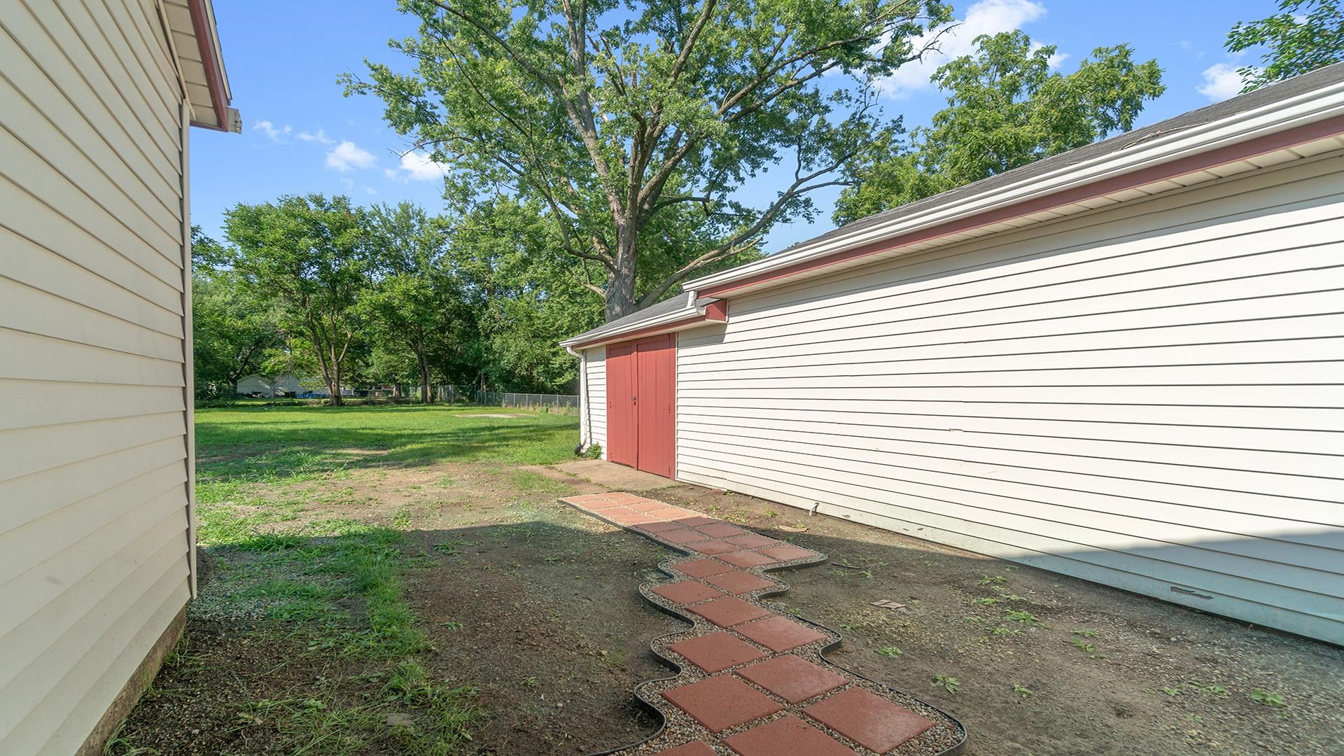 820 East Riverside Boulevard Loves Park, IL 61111 - Photo 27 of 32 a view of a backyard with a garden