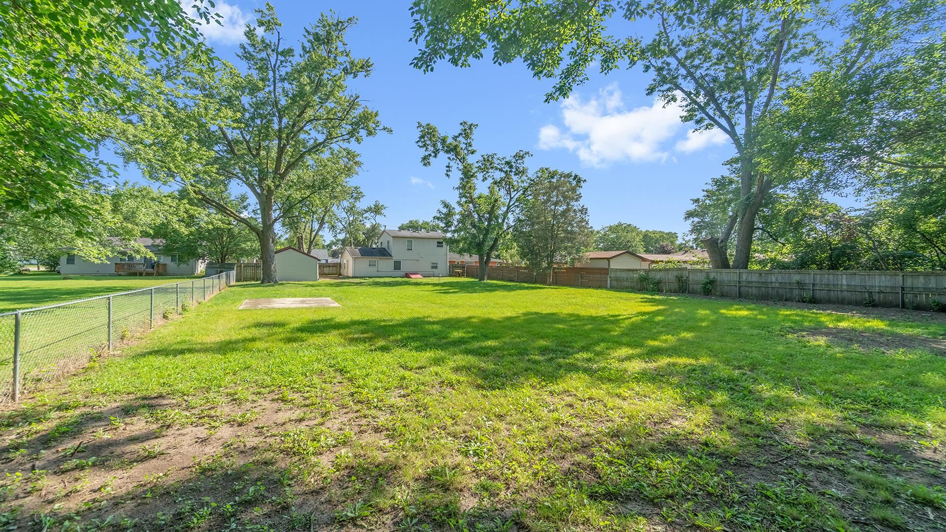 820 East Riverside Boulevard Loves Park, IL 61111 - Photo 29 of 32 a view of yard with swimming pool and green space