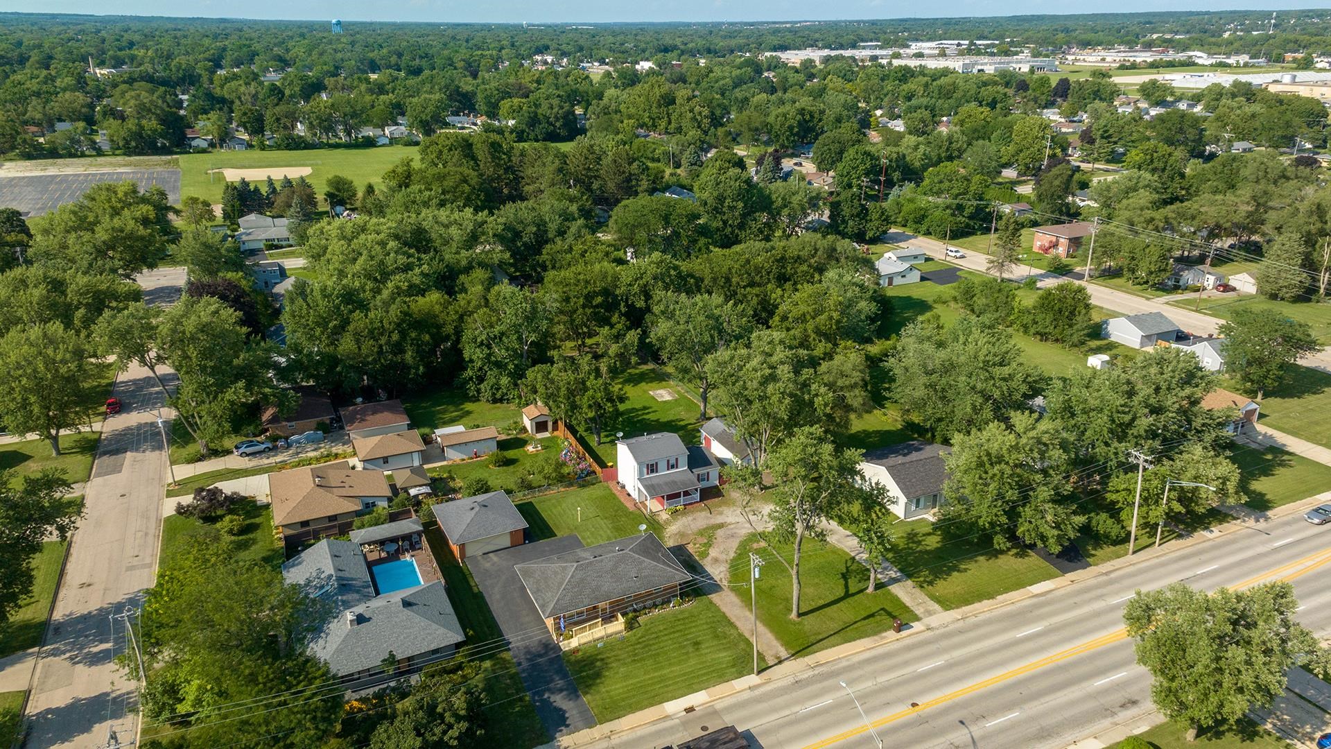 820 East Riverside Boulevard Loves Park, IL 61111 - Photo 32 of 32 an aerial view of residential house with outdoor space and trees all around