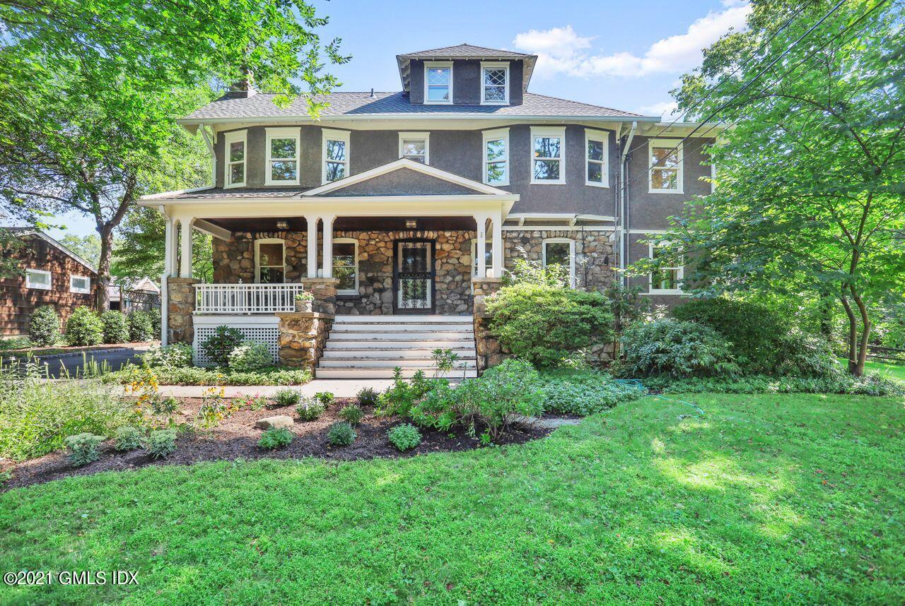 27 Sachem Road Greenwich, CT 06830 - Photo 1 of 50 a front view of a house with a yard
