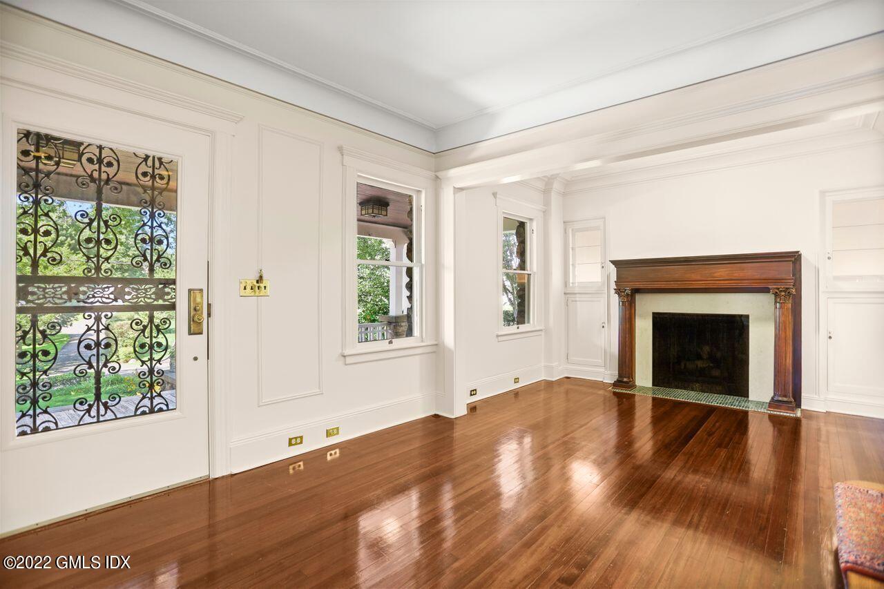 27 Sachem Road Greenwich, CT 06830 - Photo 16 of 50 a view of an empty room with wooden floor and a window