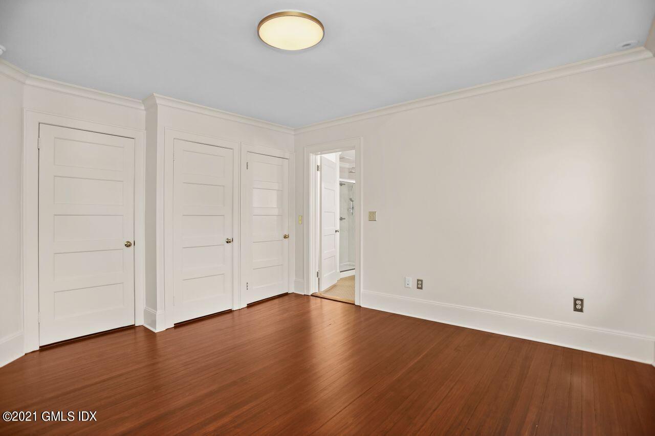 27 Sachem Road Greenwich, CT 06830 - Photo 20 of 50 an empty room with wooden floor