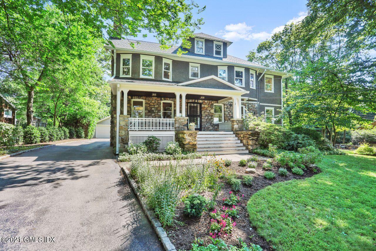 27 Sachem Road Greenwich, CT 06830 - Photo 38 of 50 a front view of a house with a garden