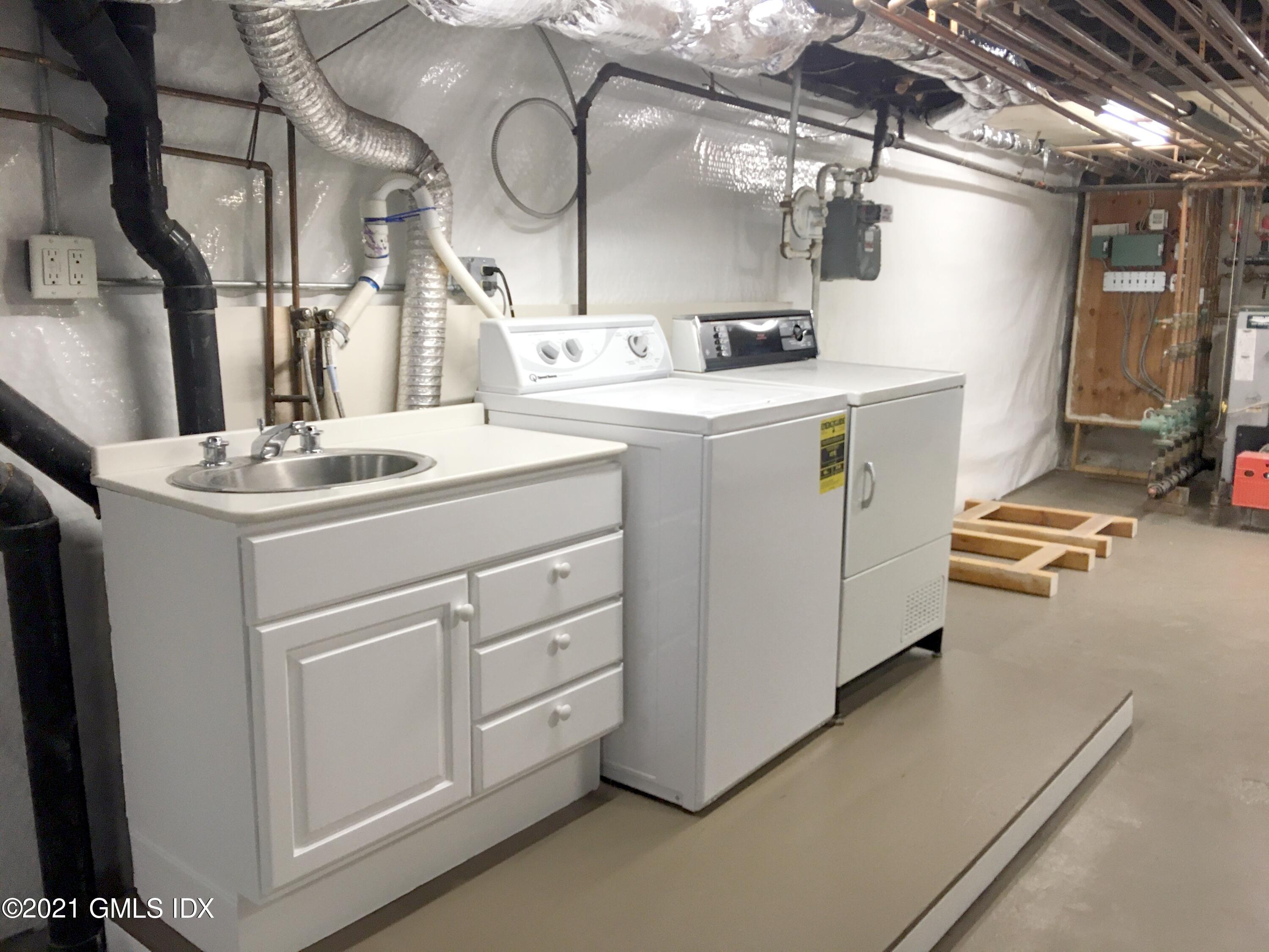 27 Sachem Road Greenwich, CT 06830 - Photo 39 of 50 a utility room with dryer and washer