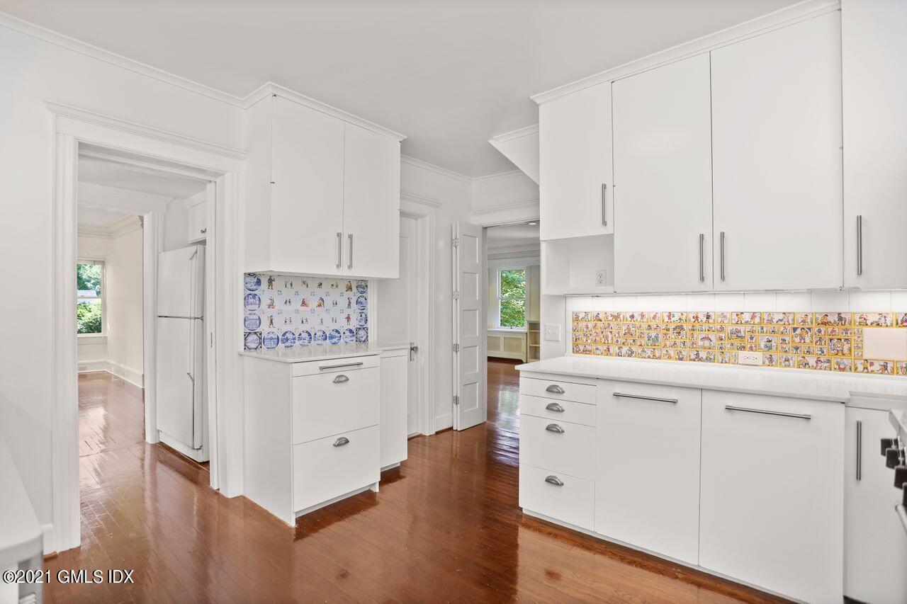 27 Sachem Road Greenwich, CT 06830 - Photo 4 of 50 a view of cabinets with wooden floor