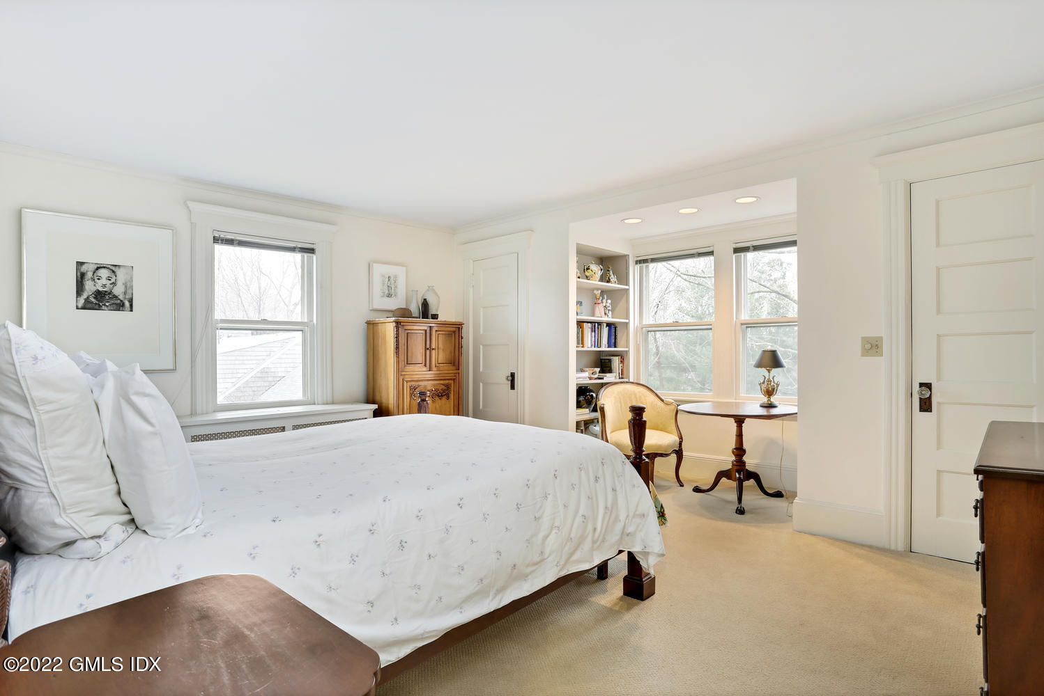 27 Sachem Road Greenwich, CT 06830 - Photo 45 of 50 a bedroom with a bed and large windows