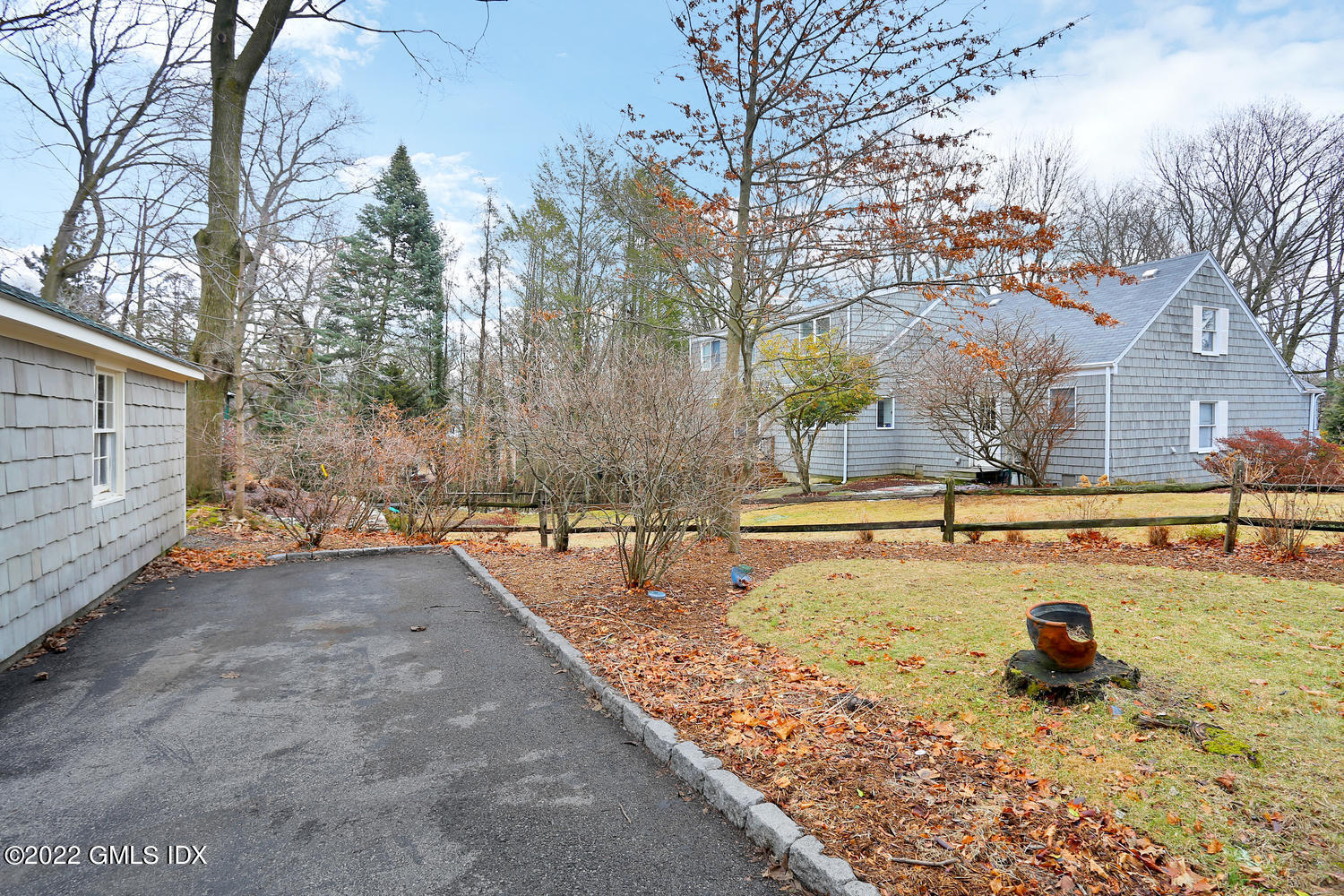 27 Sachem Road Greenwich, CT 06830 - Photo 50 of 50 a view of a backyard with snow on the road