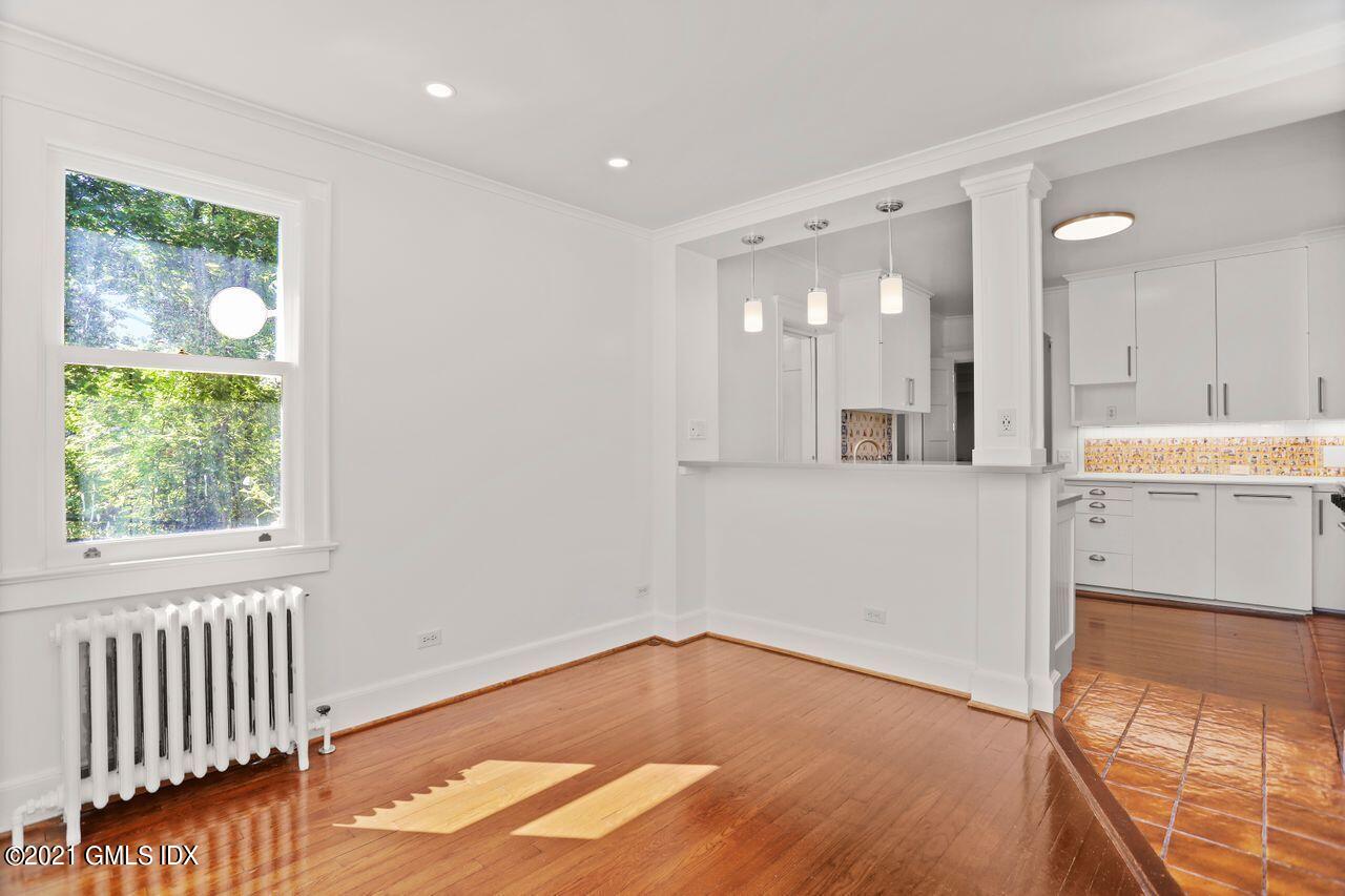 27 Sachem Road Greenwich, CT 06830 - Photo 5 of 50 a view of a kitchen with wooden floor and windows