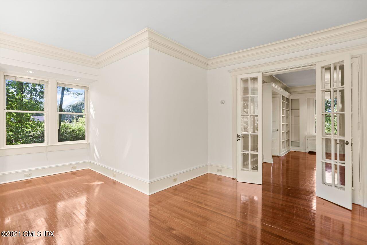27 Sachem Road Greenwich, CT 06830 - Photo 8 of 50 a view of livingroom with hardwood floor and window