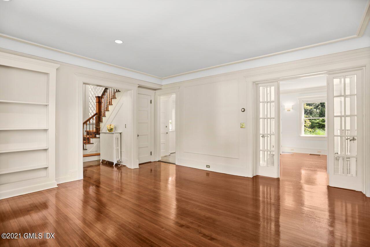 27 Sachem Road Greenwich, CT 06830 - Photo 10 of 50 a view of empty room with wooden floor and window