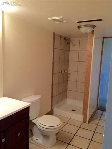 4415 Beaumont Road Colorado Springs, CO 80916 - Photo 28 of 29 Lower bath, tile, new vanity.