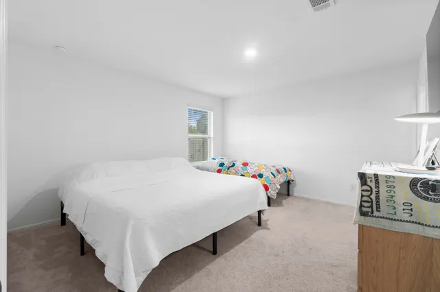 a kitchen with stainless steel appliances a refrigerator and a stove top oven