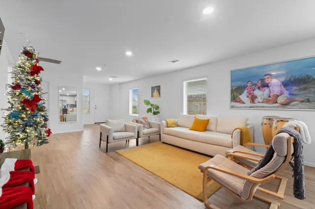 a room with furniture and flat screen tv